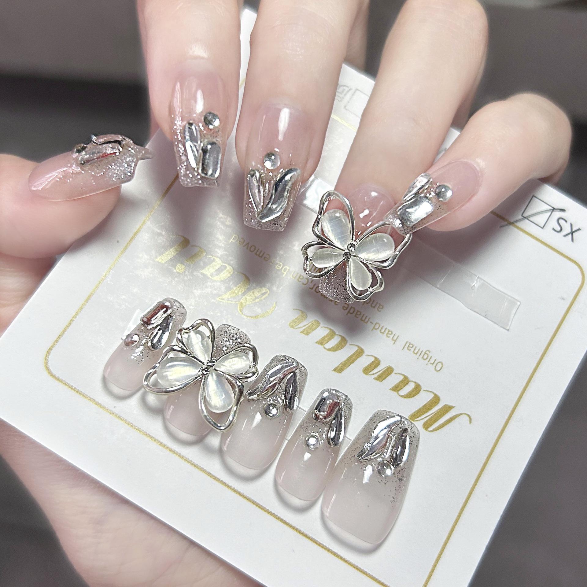 Handcrafted, luxurious short press-on nails adorned with sparkling butterfly diamonds for a stunning, skin-whitening manicure.
Handcrafted, luxurious short press-on nails adorned with sparkling butterfly diamonds for a stunning, skin-whitening manicure.