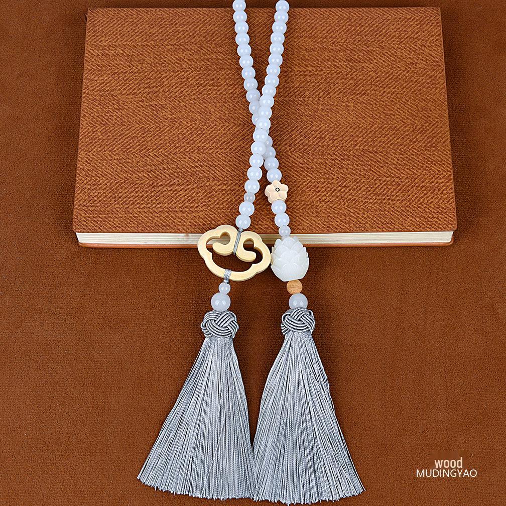 Преміальний підвіска-амулет Гуаньінь Будда з самшиту з подвійними китицями та дизайном сприятливих хмар
Преміальний підвіска-амулет Гуаньінь Будда з самшиту з подвійними китицями та дизайном сприятливих хмар