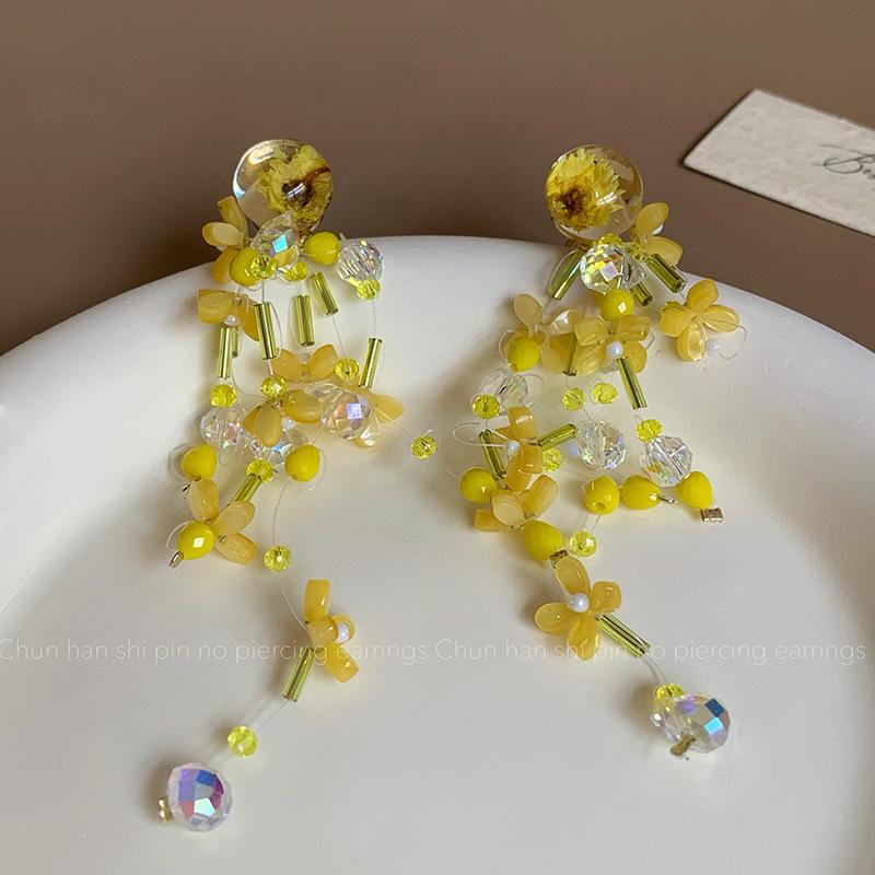 Xianmei beaded yellow flower mosquito coil disc ear clips without ear piercings female niche design sense long fringed earrings stud earrings
Xianmei beaded yellow flower mosquito coil disc ear clips without ear piercings female niche design sense long fringed earrings stud earrings