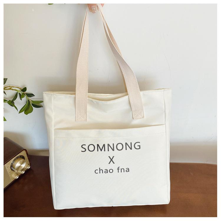 Large capacity canvas thickened waterproof 22 new college student class simple printed letter shoulder bag
Large capacity canvas thickened waterproof 22 new college student class simple printed letter shoulder bag