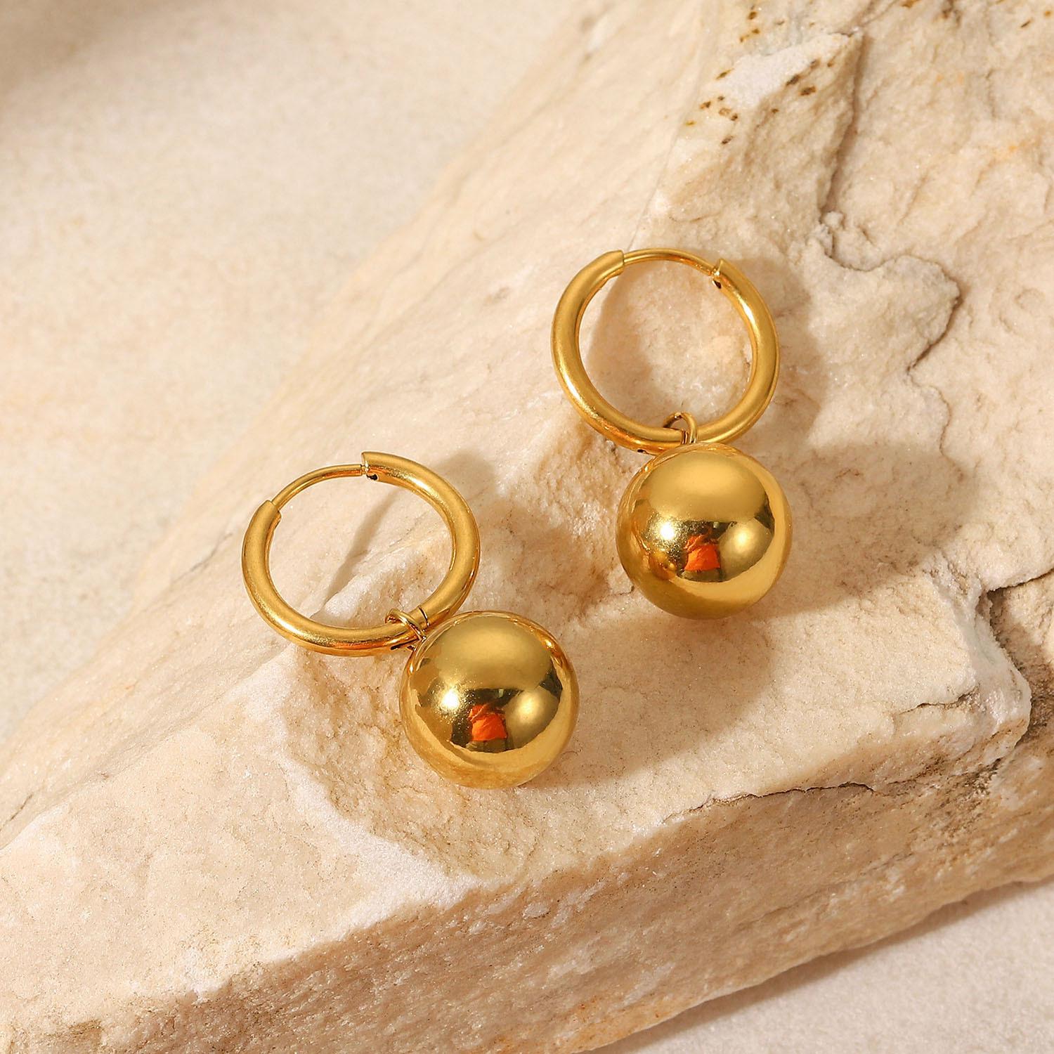 INS Fashion: 18K Gold Stainless Steel Hoop Earrings with Gold Ball Pendant, Women s Versatile Titanium Steel Jewelry
INS Fashion: 18K Gold Stainless Steel Hoop Earrings with Gold Ball Pendant, Women s Versatile Titanium Steel Jewelry