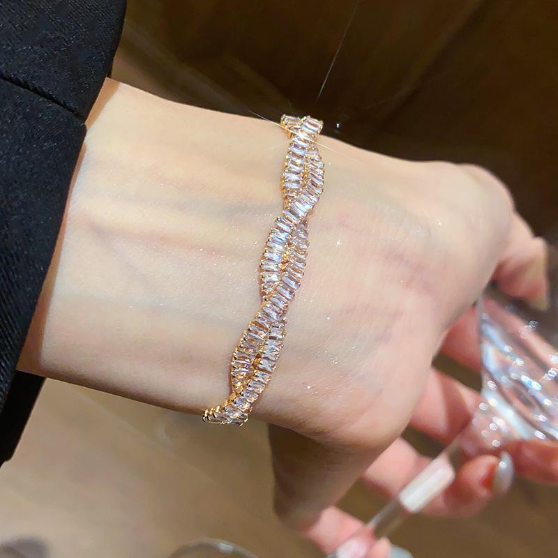 Elegant Zircon Twisted Bangle: Chic, Versatile, and Luxurious Jewelry Piece.
Elegant Zircon Twisted Bangle: Chic, Versatile, and Luxurious Jewelry Piece.