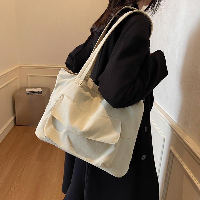 Spring large-capacity canvas literary and artistic fan solid color trendy casual simple and lightweight portable shoulder tote bag чорний
Spring large-capacity canvas literary and artistic fan solid color trendy casual simple and lightweight portable shoulder tote bag чорний
