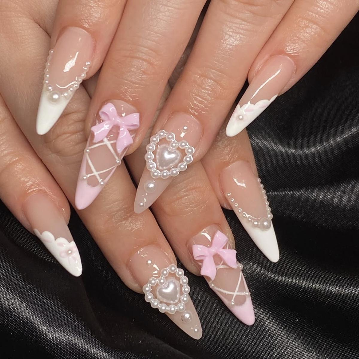Long Teardrop Wearable Nails with 3D Pearl Heart Bow and Detachable Criss-Cross Design.
Long Teardrop Wearable Nails with 3D Pearl Heart Bow and Detachable Criss-Cross Design.