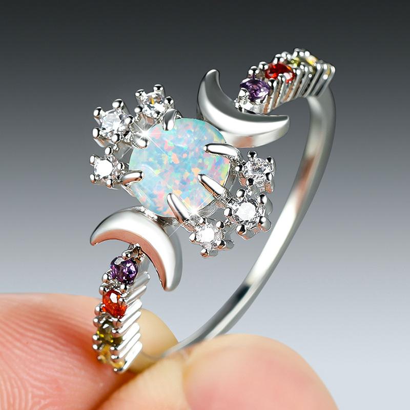 European and American personalized platinum round white opal smooth surface double moon edge inlaid with colored diamonds white diamond versatile ring no. 6
European and American personalized platinum round white opal smooth surface double moon edge inlaid with colored diamonds white diamond versatile ring no. 6