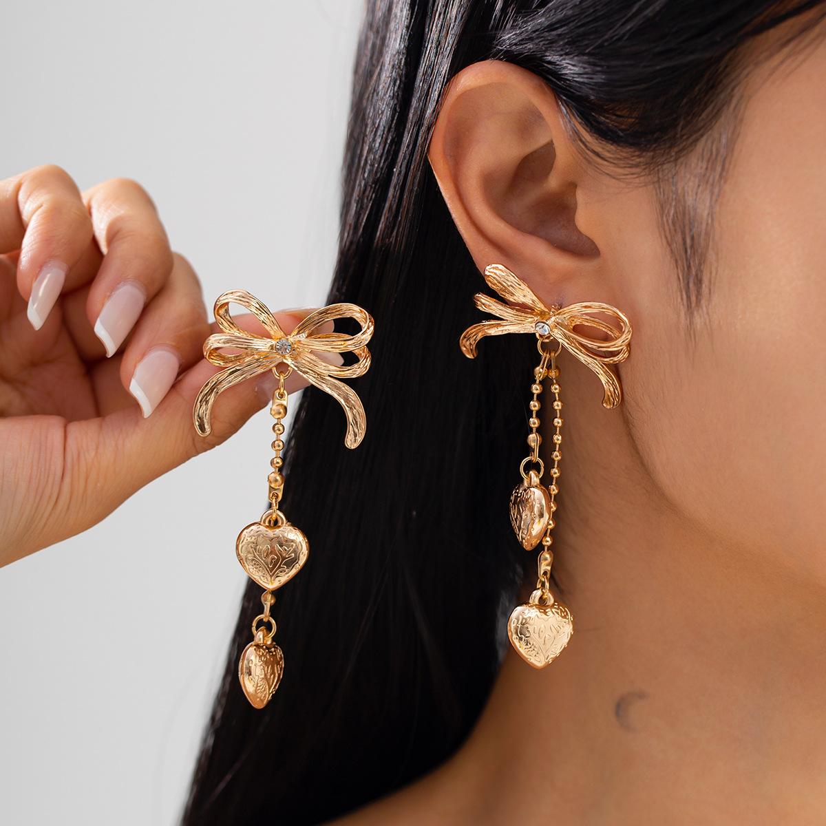 Earrings temperament long heart-shaped fringed ear jewelry, creative versatile bow stud earrings women
Earrings temperament long heart-shaped fringed ear jewelry, creative versatile bow stud earrings women