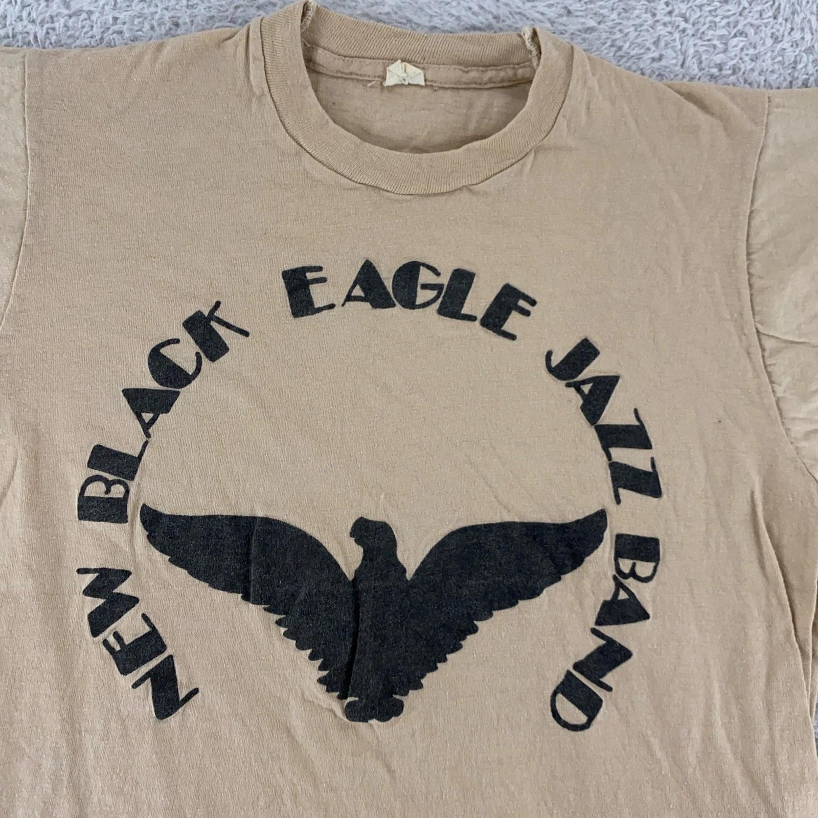 Vintage 70s Black Eagle Jazz Band Shirt Mens XXS Concert T-Shirt Tee Music 3XL
Vintage 70s Black Eagle Jazz Band Shirt Mens XXS Concert T-Shirt Tee Music 3XL