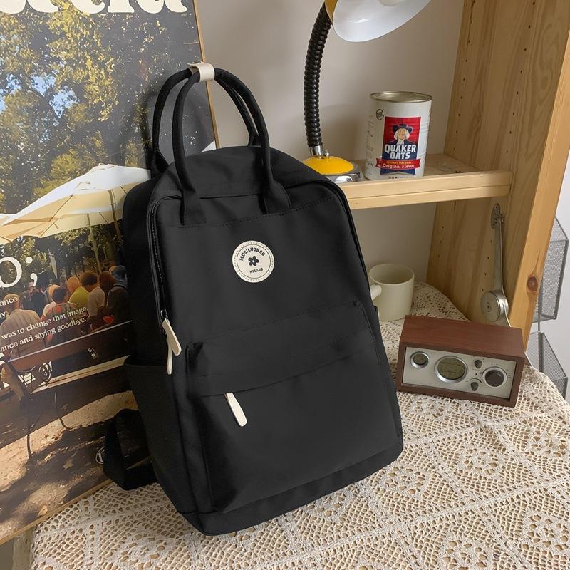 Girls backpack junior high school student schoolbag female tide large capacity solid color nylon handbag чорний
Girls backpack junior high school student schoolbag female tide large capacity solid color nylon handbag чорний