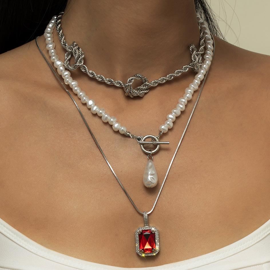 Jewelry, simple knotted twist chain necklace for women, temperament ruby imitation pearl multi-layer necklace
Jewelry, simple knotted twist chain necklace for women, temperament ruby imitation pearl multi-layer necklace