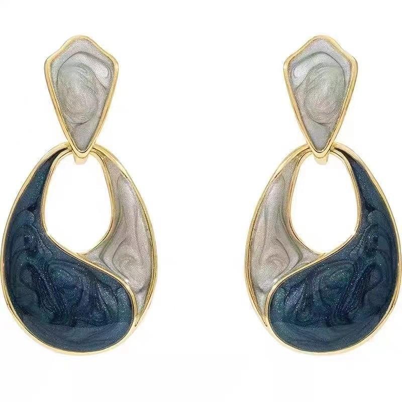 Drop Shaped Earrings with Swirl Glaze Finish and Gold Tone Frame Lightweight Statement Jewelry for Women and Girls
Drop Shaped Earrings with Swirl Glaze Finish and Gold Tone Frame Lightweight Statement Jewelry for Women and Girls