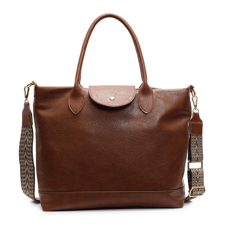 Retro commuter handbag, new messenger bag, loose tote bag, soft leather texture women s shoulder bag.
Retro commuter handbag, new messenger bag, loose tote bag, soft leather texture women s shoulder bag.