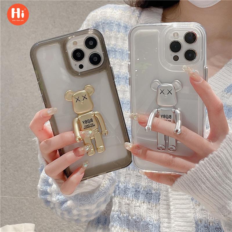 Solid color space case, suitable for Apple 15 mobile phone case, bear holder, iPhone13/14Pro max transparent hard case. 
Solid color space case, suitable for Apple 15 mobile phone case, bear holder, iPhone13/14Pro max transparent hard case.