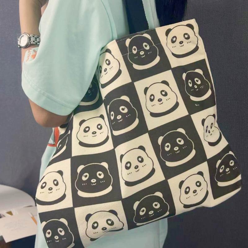 Портативная сумка-тоут нишевого дизайна с головой черно-белой панды большой вместимости
Портативная сумка-тоут нишевого дизайна с головой черно-белой панды большой вместимости