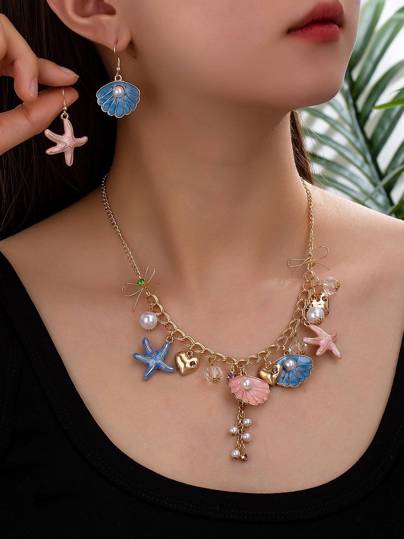 Ocean vacation style pearl shell starfish earrings fresh and sweet love bow pendant necklace золотий
Ocean vacation style pearl shell starfish earrings fresh and sweet love bow pendant necklace золотий
