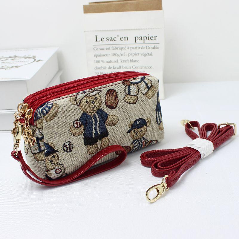 Женский трехслойный кошелек для мелочи Pure Beauty Bear wine red with long shoulder strap version
Женский трехслойный кошелек для мелочи Pure Beauty Bear wine red with long shoulder strap version