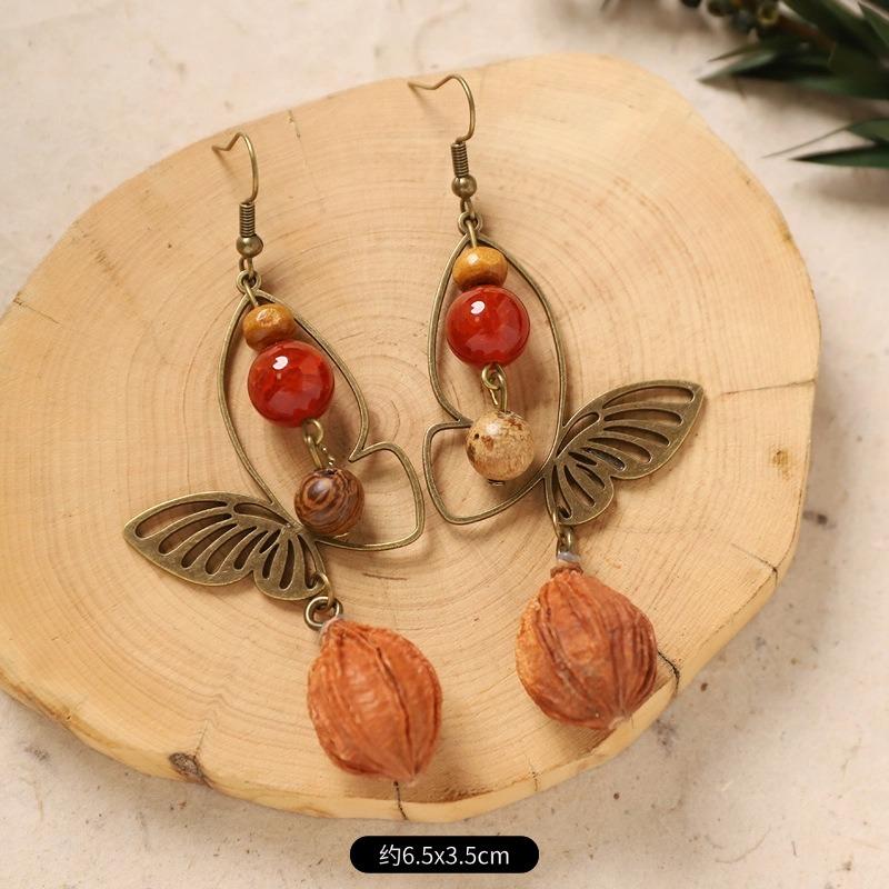 Оригинальные серьги-пуссеты с плодами растения-бабочки, ретро нишевый дизайн, литературные длинные серьги-желуди для женщин
Оригинальные серьги-пуссеты с плодами растения-бабочки, ретро нишевый дизайн, литературные длинные серьги-желуди для женщин