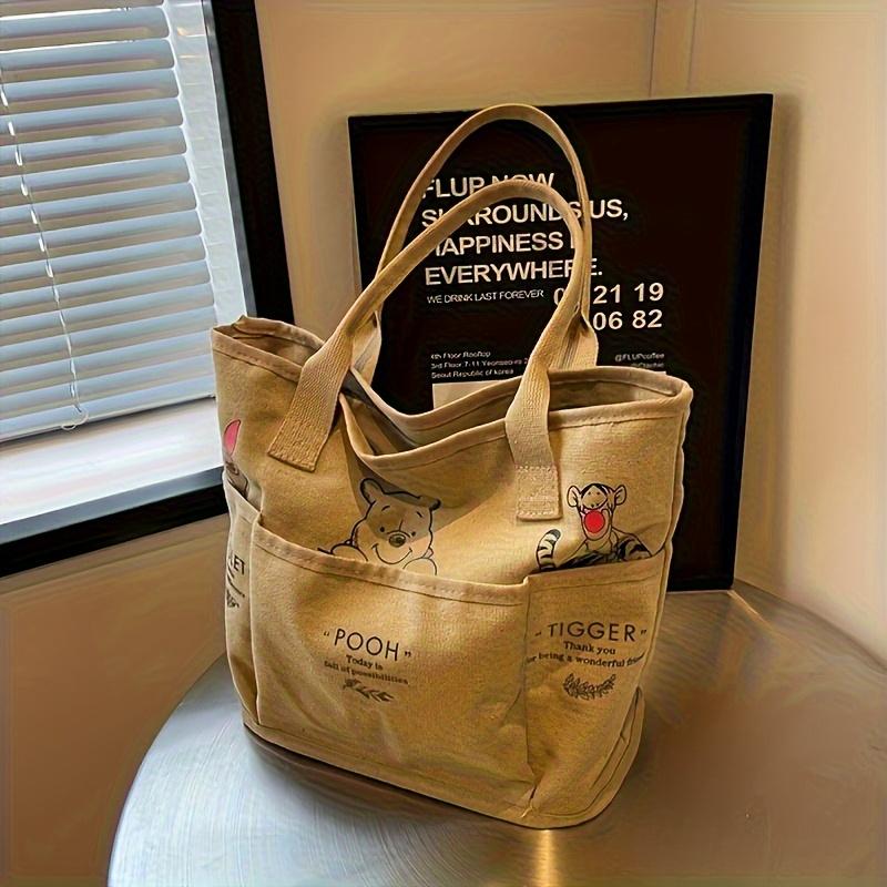 Disney Winnie The Pooh Printed Canvas Handbag Retro Shoulder Bag Large Capacity Multi-pocket Lightweight Handbag Student Commuter Bag коричневый
Disney Winnie The Pooh Printed Canvas Handbag Retro Shoulder Bag Large Capacity Multi-pocket Lightweight Handbag Student Commuter Bag коричневый