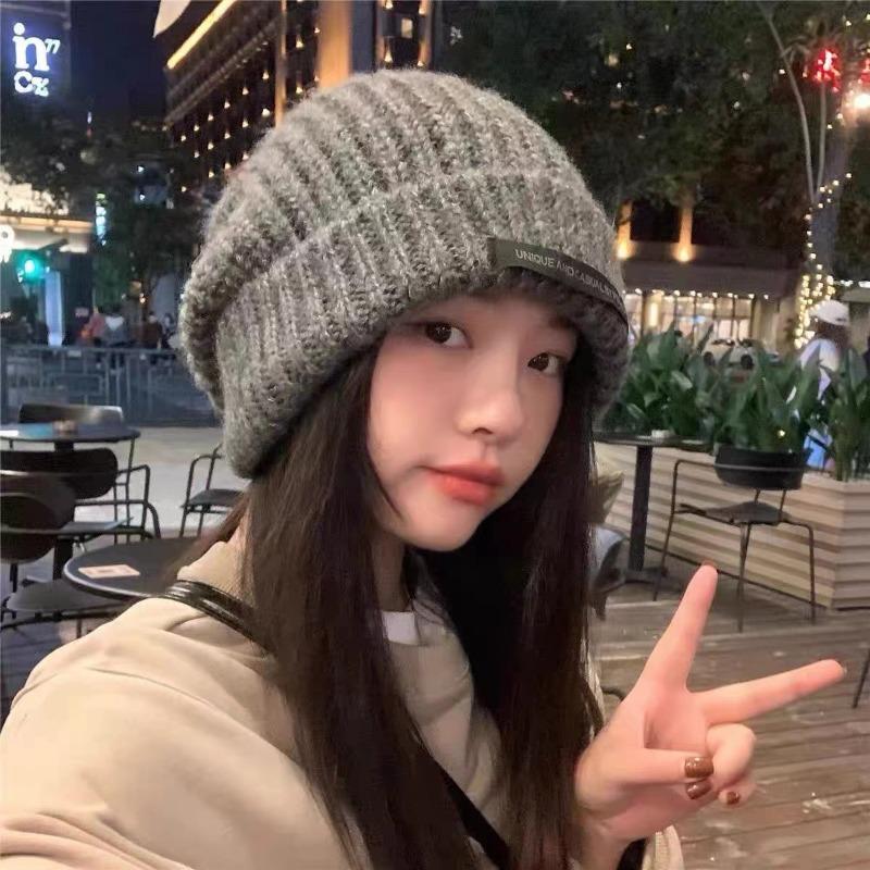 Hats Women's autumn and winter knitted hats Student wool hats Show small face Warm pile ear hats