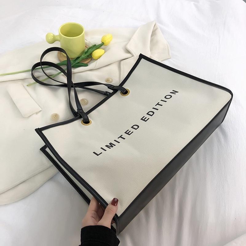 IELGY large-capacity trendy commuter canvas bag
