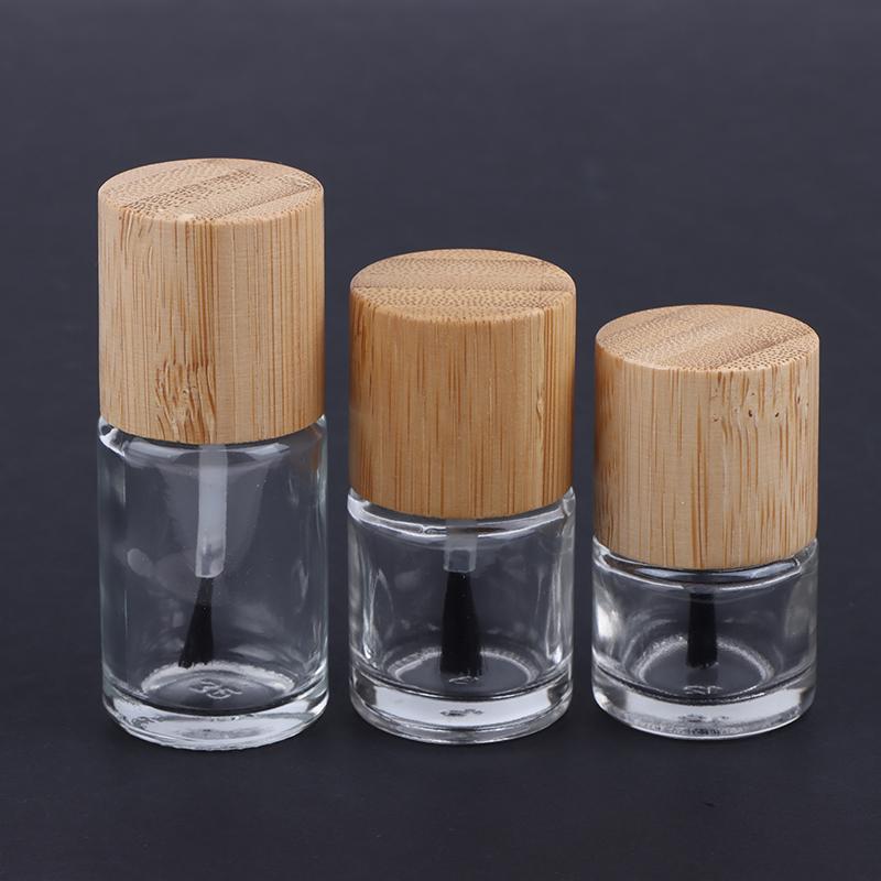 Cylindrical Glass Nail Oil Bottles with Solid Wood and Bamboo Caps – Available In 5ml, 10ml, and 15ml Capacities