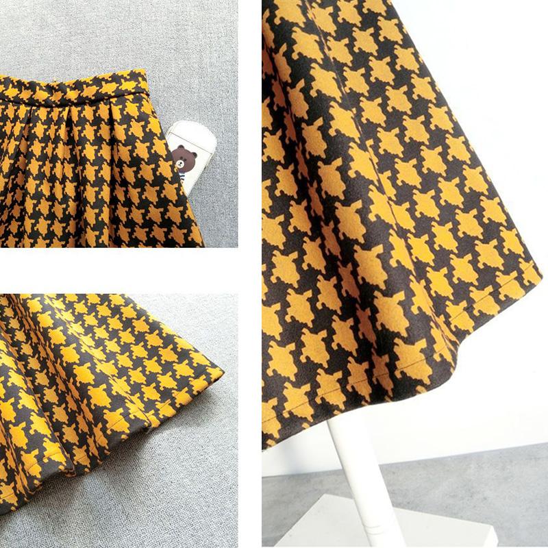 Falda de lana a cuadros para mujer Otoño e Invierno media falda de cintura alta y delgada falda de una línea de pata de gallo