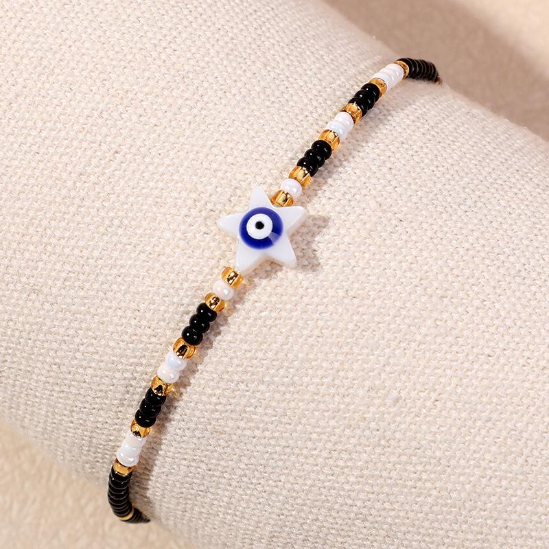 Bracelet en perles d'œil du diable tissé à la main avec motif de niche en verre