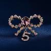 Temperament Schleife 5-Zeichen Brosche Persönlichkeit Kristallbrosche Nische Premium Design Anstecknadel Anzug Accessoires