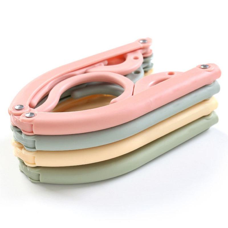 Portable Folding Non-Slip Hanger for Adults & Children - Multifunctional, Retractable, Traceless Design for Travel & Home Use.