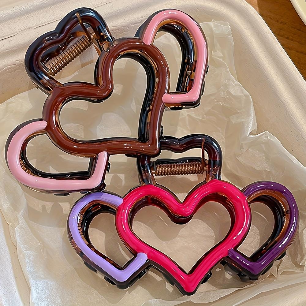 One elegant heart-shaped hairpin, a half-tied hairpin, a stylish hairpin, and a shark clip at the back of the head