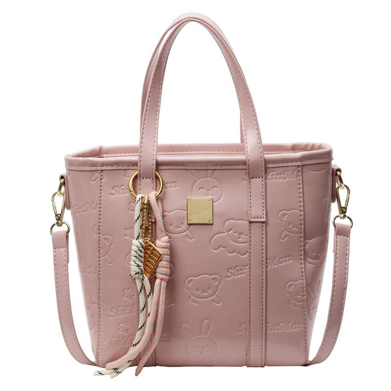 Korean version of high-end fashion and cute embossed portable bucket bag, women's commuting versatile foreign style messenger bag