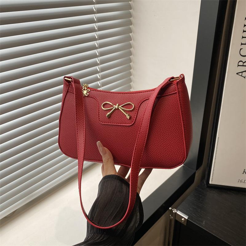 Solid color fashion bow new trendy texture commuting shoulder underarm baguette bag women