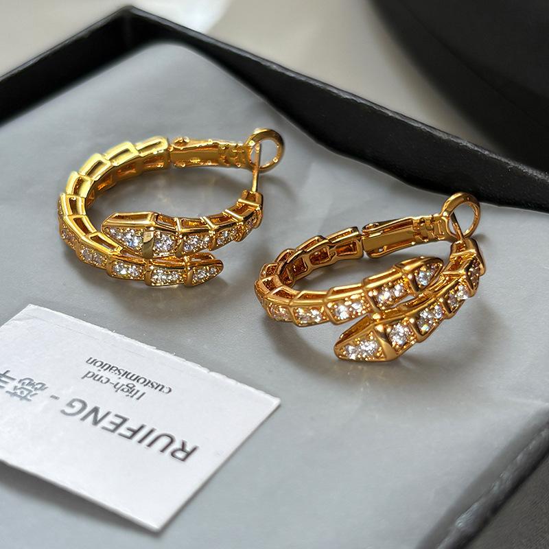 

K white gold electroplated silver with diamonds full of zirconium personalized earrings unique design elastic snake bone ear buckle female tide
