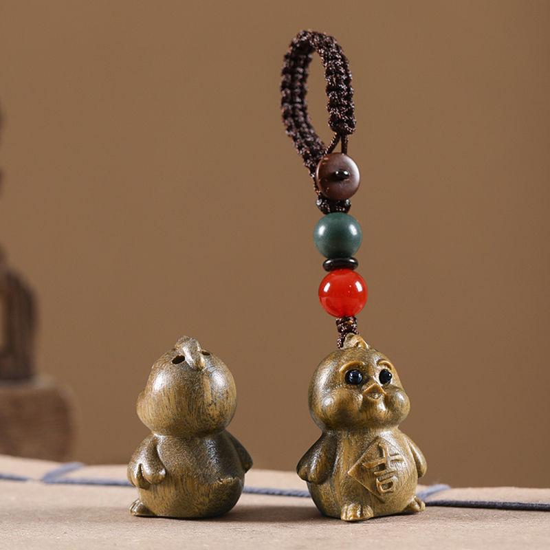Twelve Zodiac Animal Charms Green Sandalwood Set: Rat, Ox, Tiger, Rabbit, Dragon, Snake, Horse, Sheep, Monkey, Rooster, Dog, Pig.