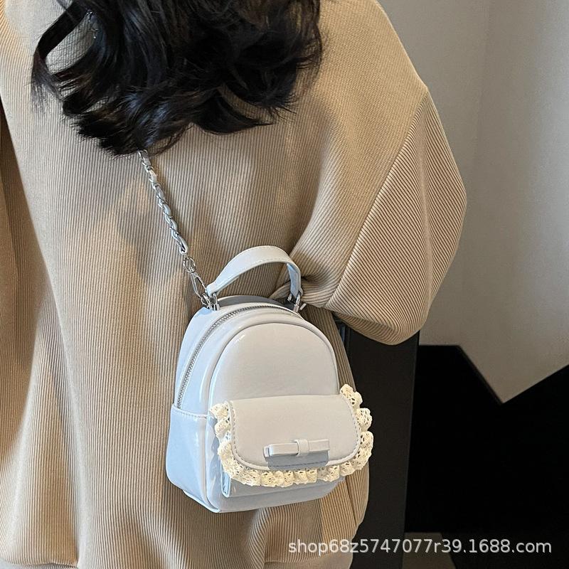 Korean fashion hand-held crossbody bag women's 2025 summer new simple bow backpack casual school bag