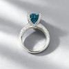 Xiancan Jewelry S925 Silver Oval Paraiba Ice Flower Cut Ring with High Carbon Diamond.