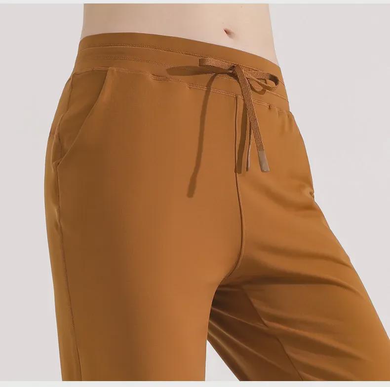 Women's Green Drawstring Quick-Dry Sports Pants: Lightweight, High-End, Straight-Leg Design for Summer.