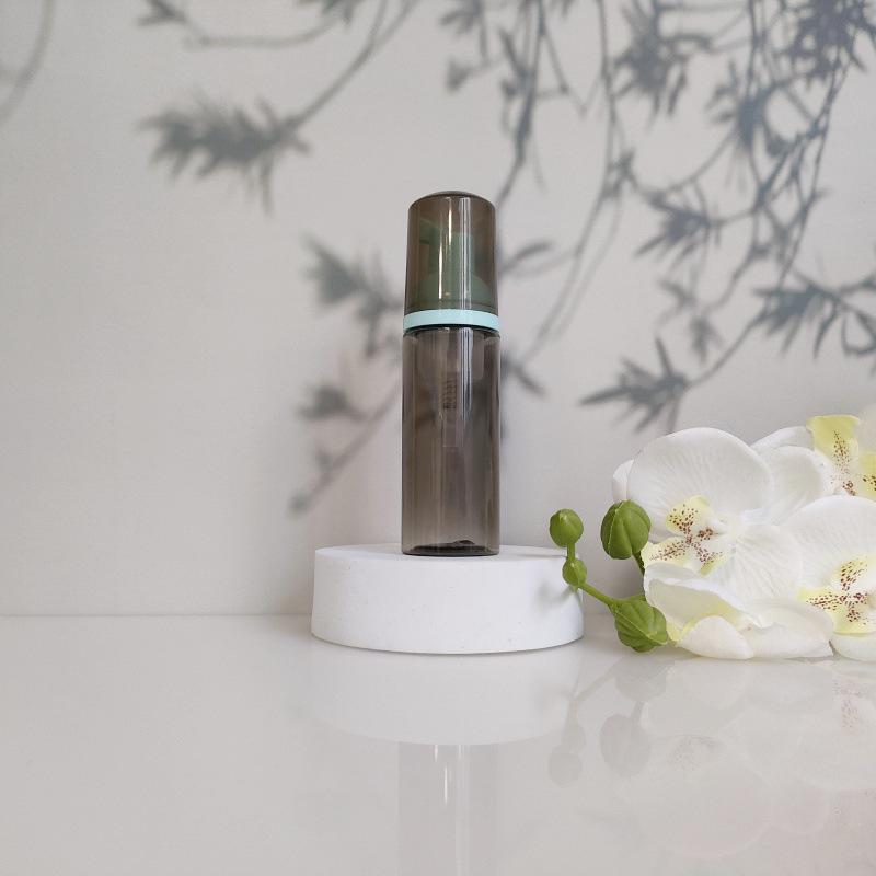 Available 60ml Transparent Black Foam Mousse Bottle for Face Wash and Travel-friendly Cosmetic Packaging.