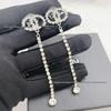 Eleganti Orecchini con Frange e Strass Doppia C per Donna