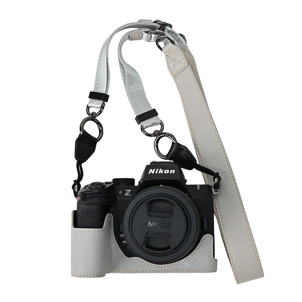 Z50II PU kůže s potiskem dlaně Poloviční pouzdro na fotoaparát pro Nikon Z50II Otevírání baterie Spodní kryt s popruhem na krk