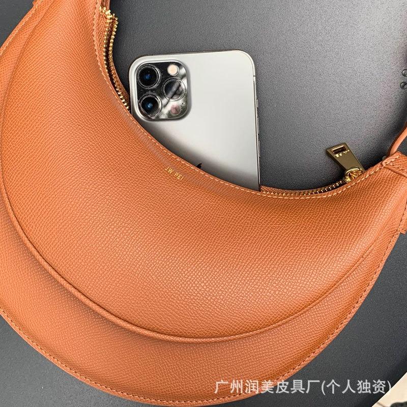 J-Sichel-Tasche, neue Achseltasche, Premium-Schultertasche, Nischen-Design, Satteltasche, Pendler-Umhängetasche.