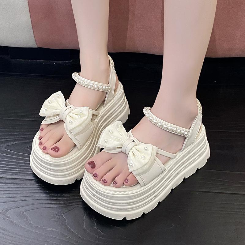 Platform bow sandals female popular summer new Korean version fairy wind pearl one-word buckle with muffin beach sandals
