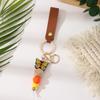 European & American Sweet Butterfly Daisy Silicone Beaded Keychain with Leather Bow Pendant