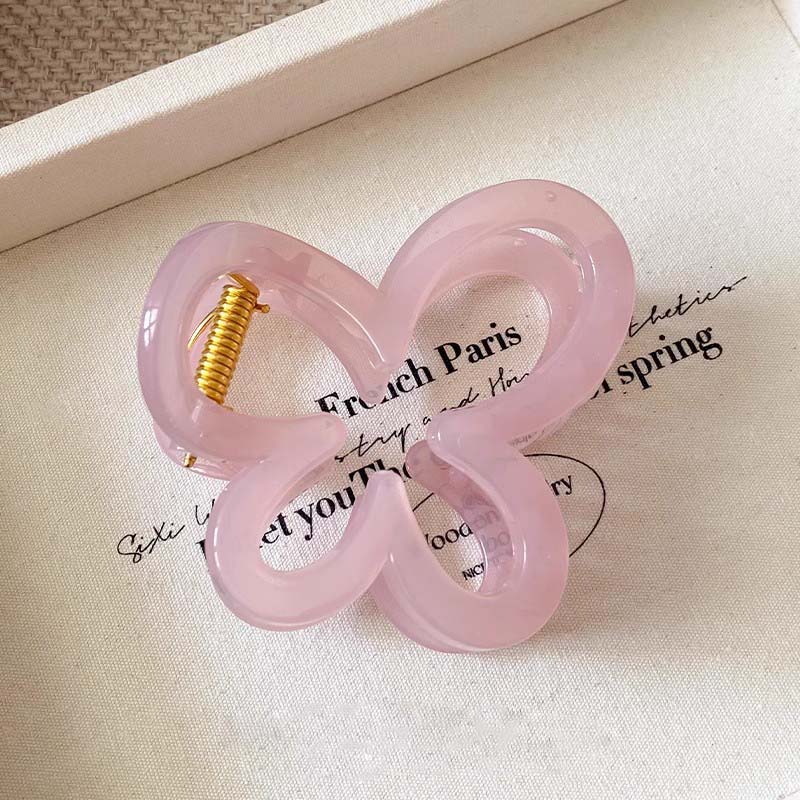 Neue einfarbige Schmetterlings-Haarklammer für Frauen Mädchen Süße kleine hohle Hinterkopf-Haifischklemme Haargreifer Haaraccessoires