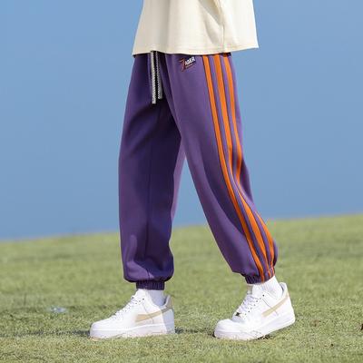 Męskie wiosenne i jesienne amerykańskie retro sportowe gorsetowe spodnie modowe markowe młodzieżowe spodnie dresowe z prostymi nogawkami i luźnymi kolorowymi patchworkami