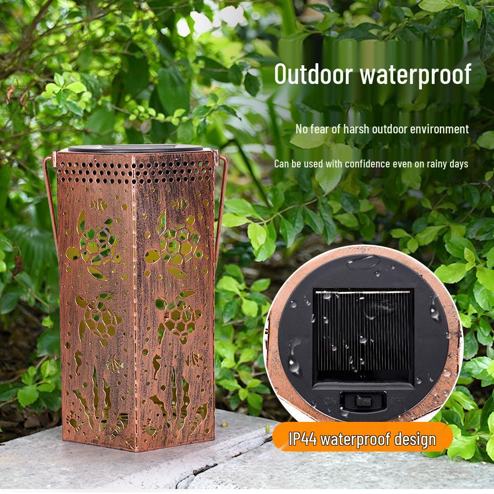 Outdoor Solar Wrought Iron Lantern: Waterproof Hollow Projection Table Lamp for Courtyard and Garden