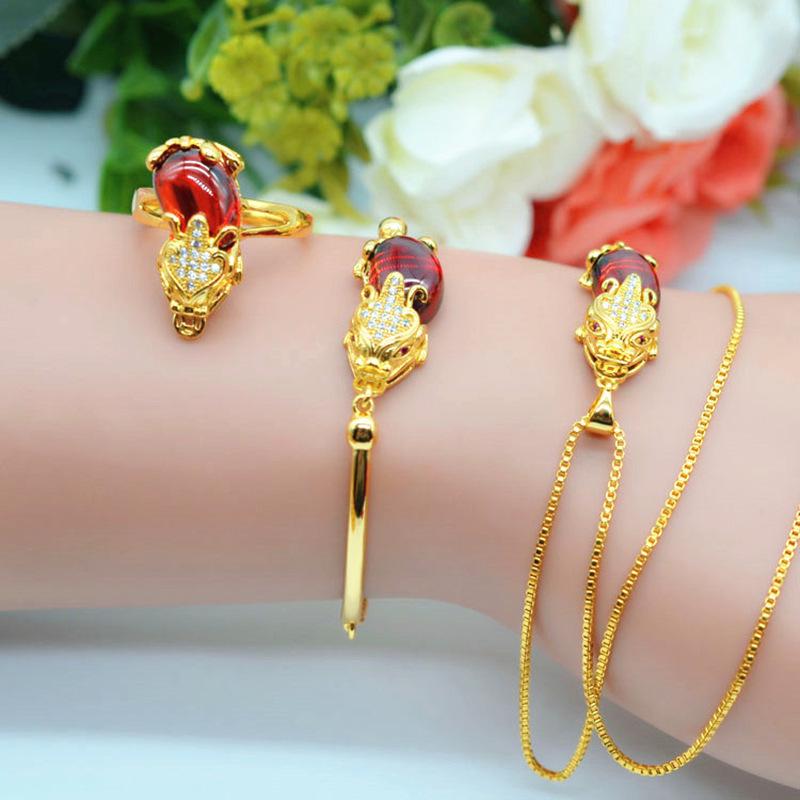 Vietnamese Gold-Plated Brass Jewelry Set with Red Corundum Gemstone: Pixiu Ring, Bracelet, and Necklace.