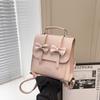 South Korea solid color college style commuter backpack women 2025 new trend bow portable shoulder messenger bag