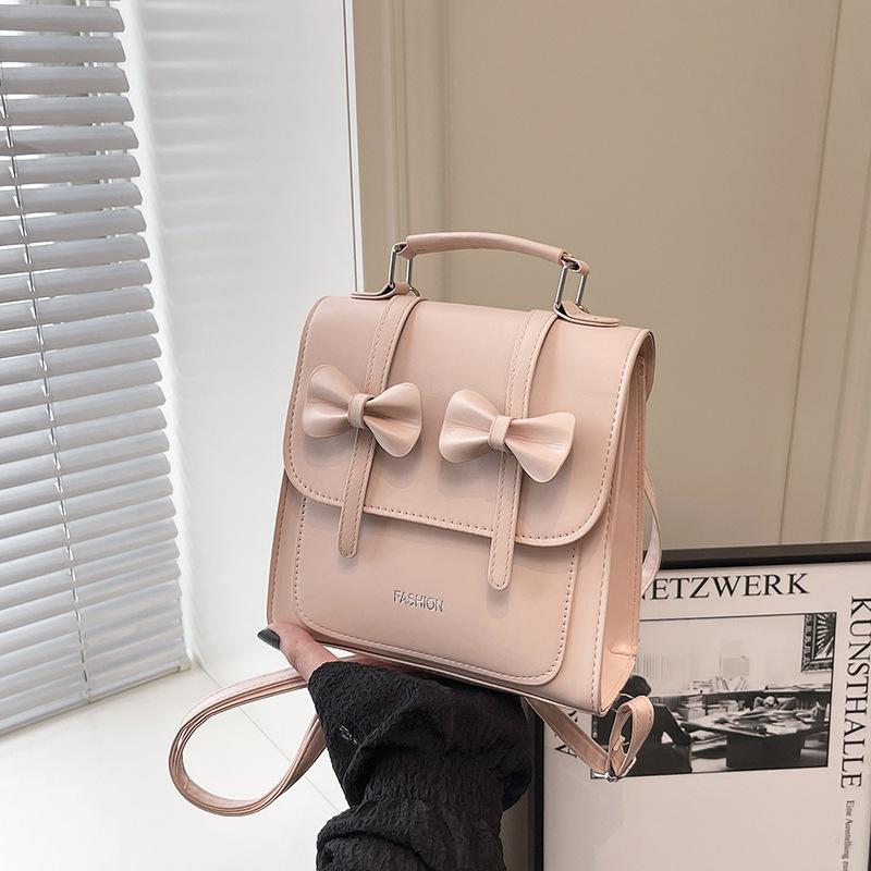 South Korea solid color college style commuter backpack women 2025 new trend bow portable shoulder messenger bag