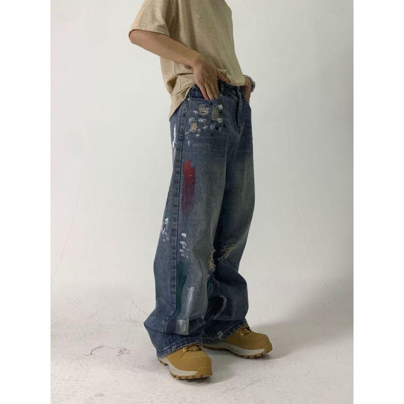 Europejskie i amerykańskie dżinsy uliczne z plamami atramentu dla mężczyzn i kobiet niszowy design z dziurami luźne spodnie z szerokimi nogawkami dla par codzienne spodnie na wszystkie mecze