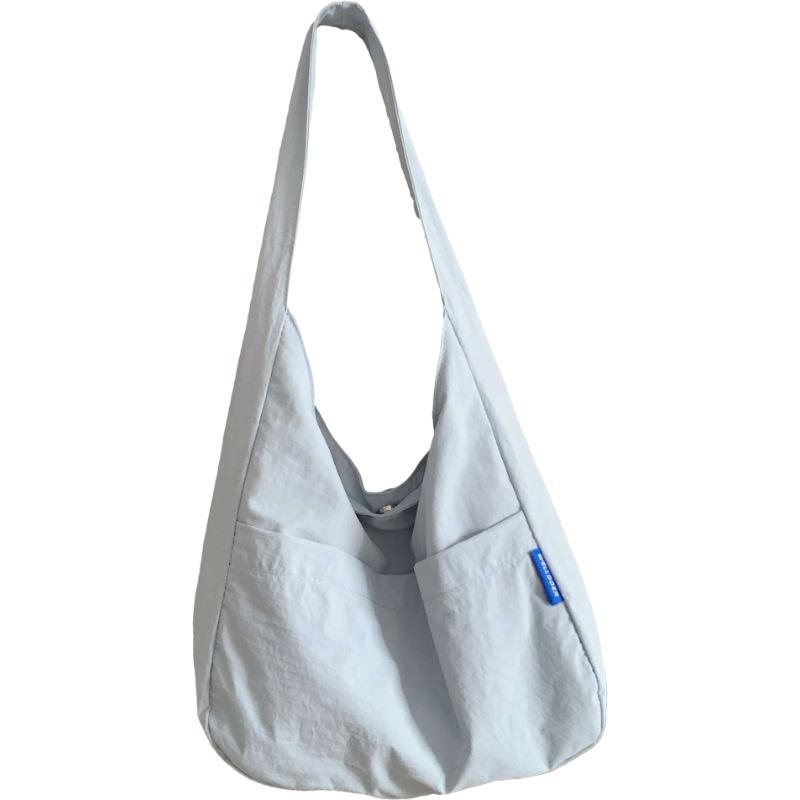 Japon et Corée du Sud sac fourre-tout couleur unie style décontracté pour femme sac à bandoulière polyvalent décontracté pour les trajets quotidiens grande capacité sac pour étudiants cours soutien scolaire
